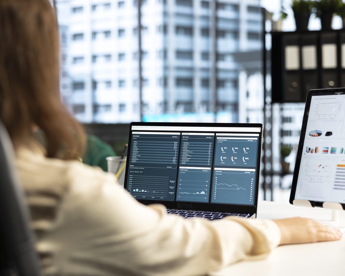 A manager reviewing an AI-drafted training module on a laptop